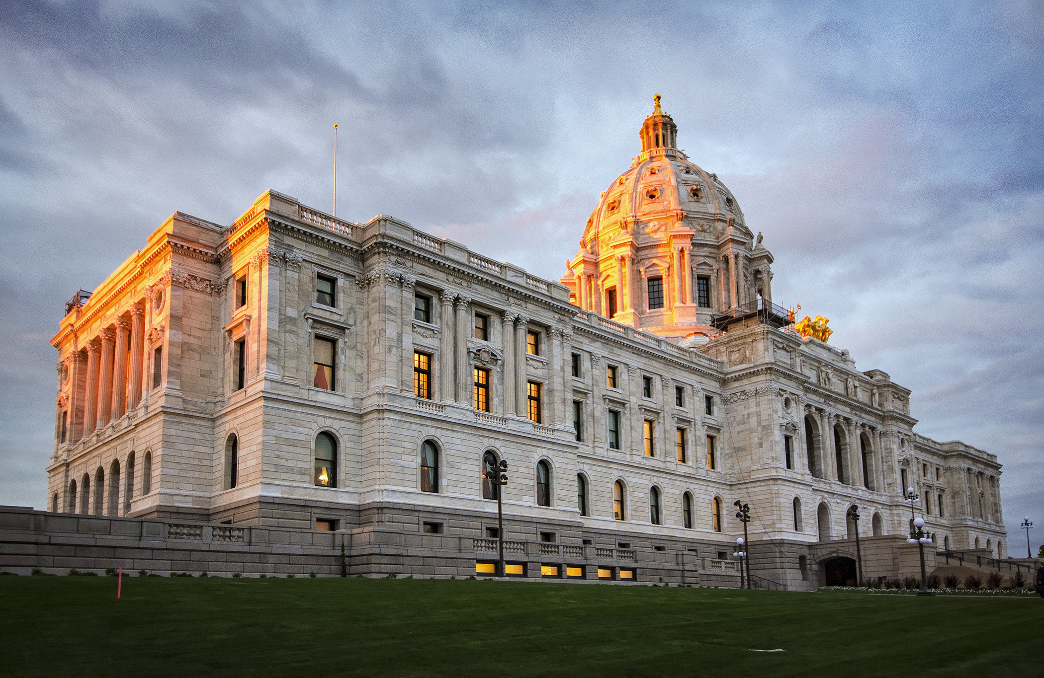 The last rays of sunlight bathe the State Capitol in an orange glow Tuesday evening. Photo by Andrew VonBank